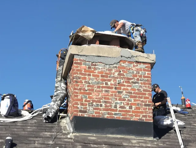 Wellington Chimney Sweep installing a custom chimney crown in Wellington, FL