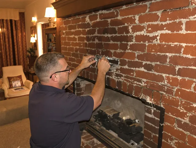 Wellington Chimney Sweep expert fixing a fireplace in Wellington, FL